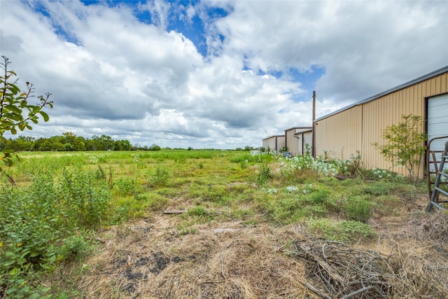 view of yard with a rural view