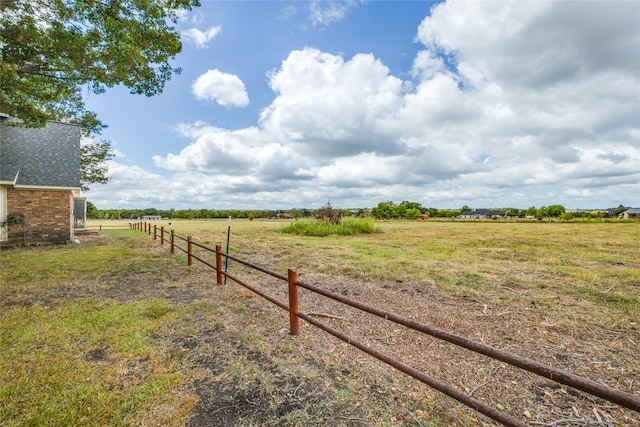 view of yard with a rural view