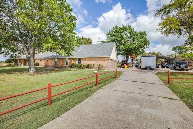 single story home featuring a front lawn and a carport