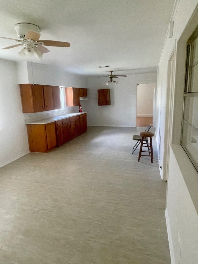 unfurnished room featuring light hardwood / wood-style flooring and ceiling fan