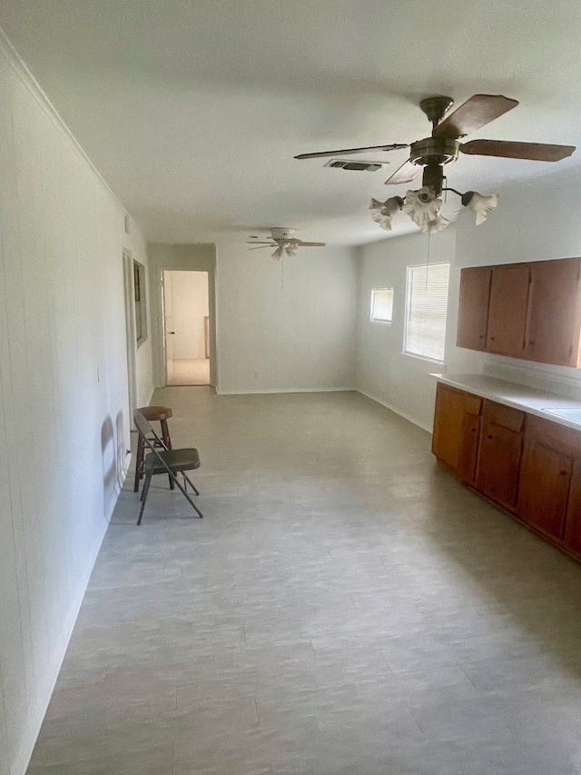 spare room featuring ceiling fan and light hardwood / wood-style floors