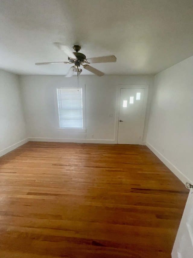 unfurnished room featuring ceiling fan, light hardwood / wood-style floors, and a textured ceiling