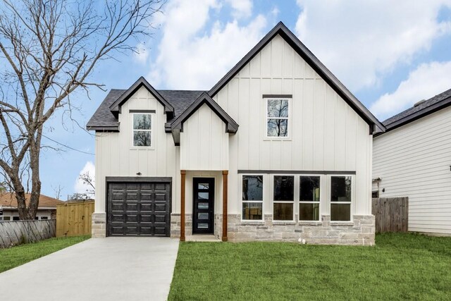 modern farmhouse style home featuring a garage and a front yard