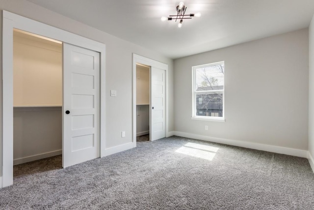 unfurnished bedroom with a closet and carpet