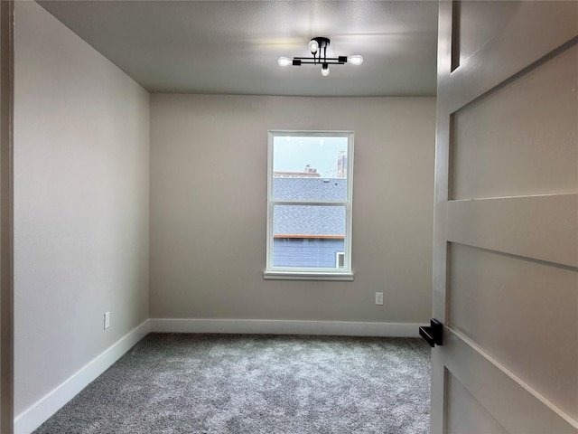 spare room featuring carpet floors