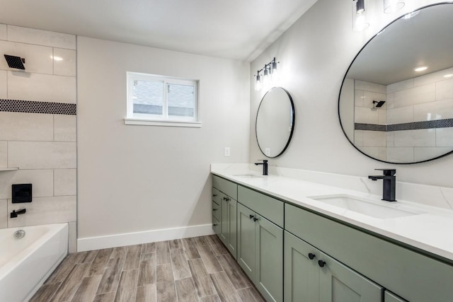 bathroom with vanity and tiled shower / bath