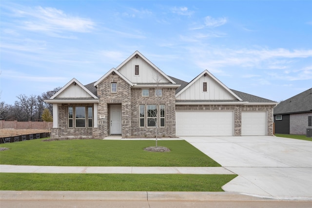 view of front of house with a garage and a front lawn