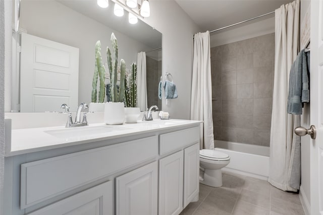 full bathroom with vanity, shower / bath combo with shower curtain, toilet, and tile patterned floors