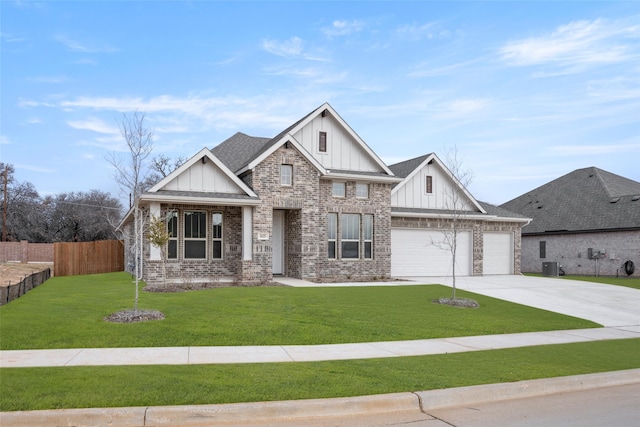 view of front of property with a garage, a front yard, and central air condition unit