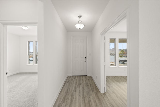 foyer entrance with light wood-type flooring