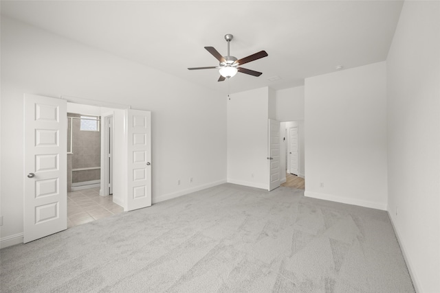 interior space with ceiling fan and light carpet