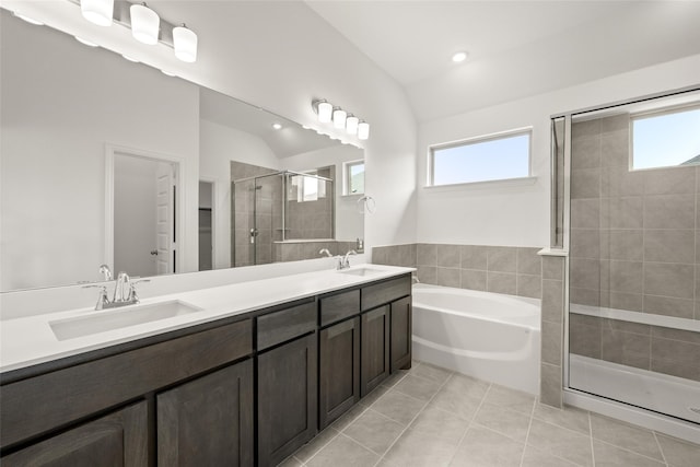 bathroom featuring tile patterned floors, plus walk in shower, vaulted ceiling, and plenty of natural light