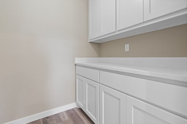 washroom with light hardwood / wood-style flooring