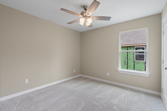 empty room featuring carpet and ceiling fan