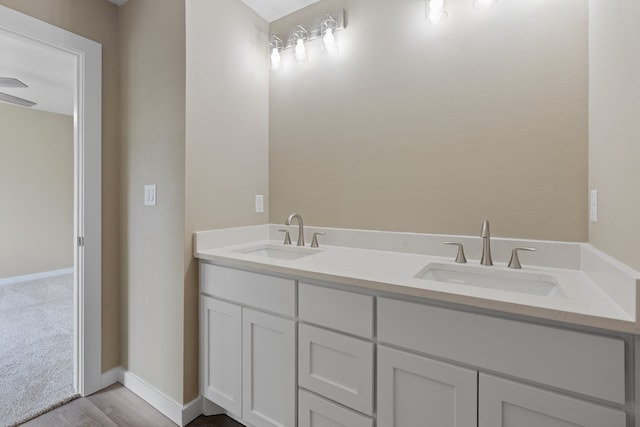 bathroom featuring vanity and hardwood / wood-style floors