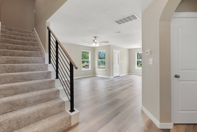 foyer entrance featuring light wood-type flooring and ceiling fan