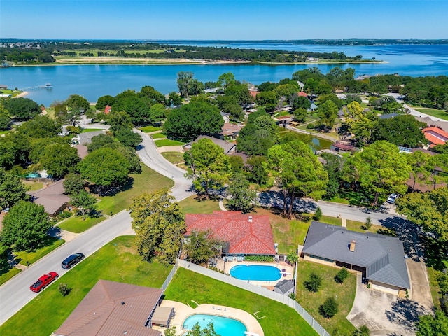 birds eye view of property with a water view