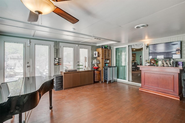 interior space with french doors, hardwood / wood-style flooring, and ceiling fan