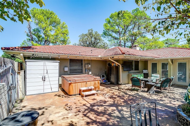 view of patio / terrace featuring a hot tub