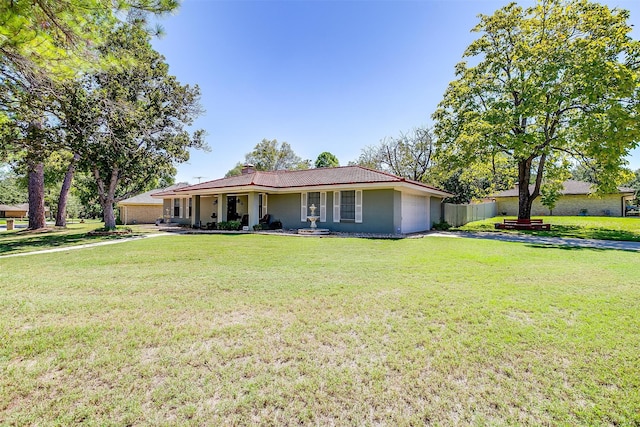 single story home featuring a front yard