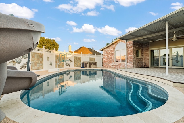 view of pool featuring ceiling fan and a patio