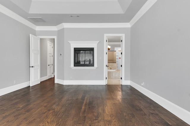 unfurnished living room with dark hardwood / wood-style flooring and ornamental molding