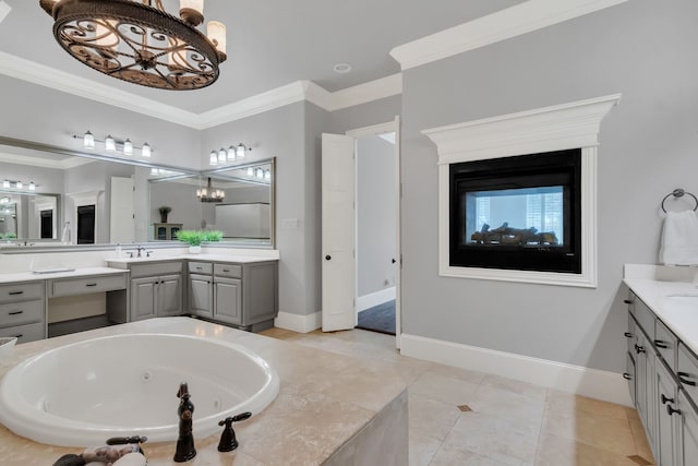 bathroom featuring vanity, tiled bath, crown molding, tile patterned flooring, and a chandelier