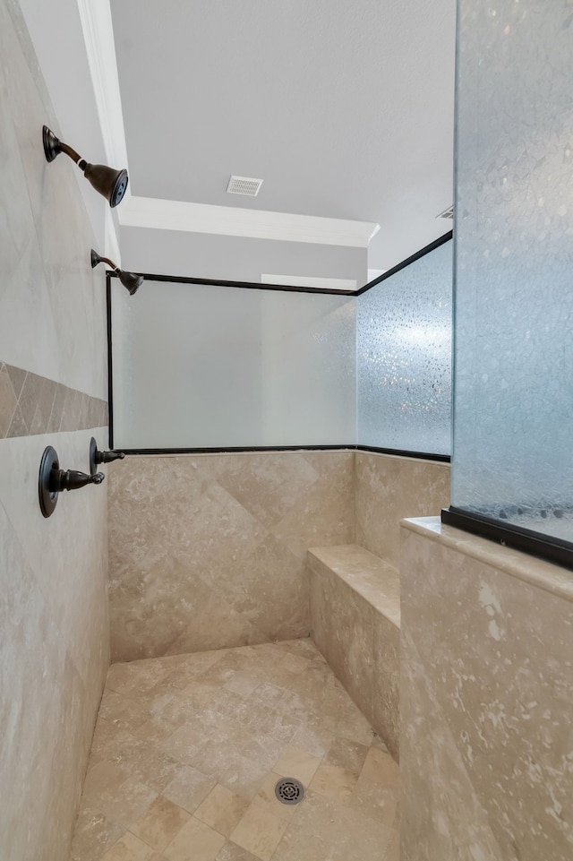 bathroom featuring a tile shower