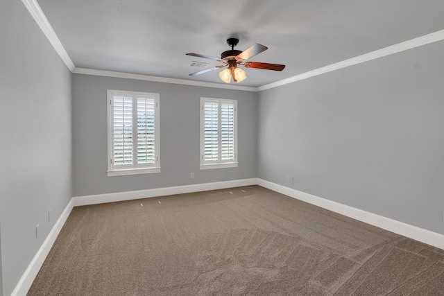 spare room featuring carpet flooring, ceiling fan, and crown molding