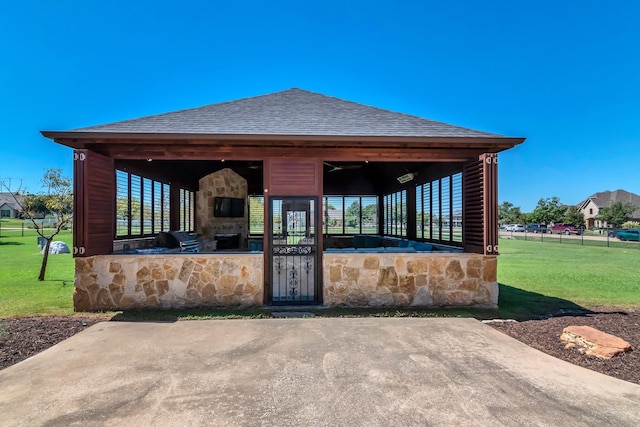 surrounding community featuring a gazebo, area for grilling, and a yard