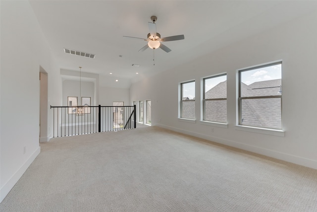 spare room with ceiling fan and carpet flooring