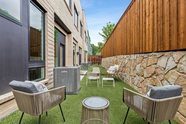 exterior space featuring cooling unit and an outdoor hangout area