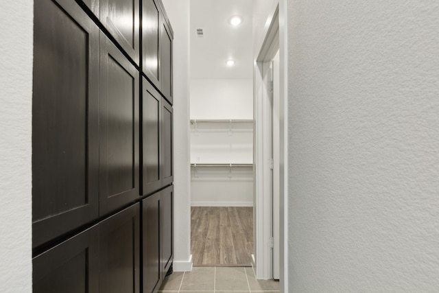 walk in closet featuring light tile patterned floors