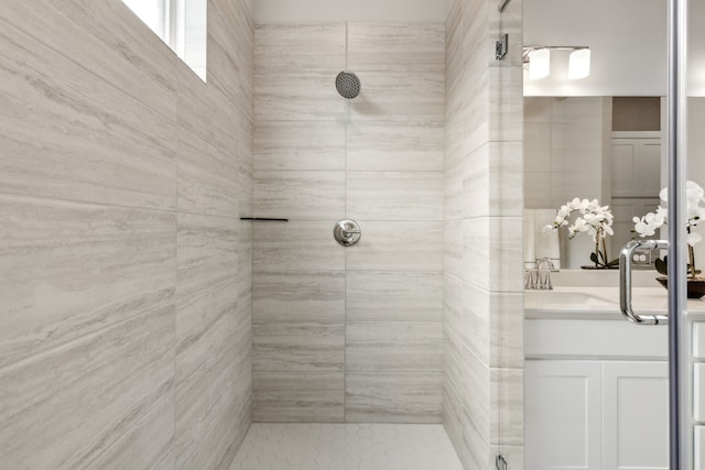 bathroom featuring vanity and an enclosed shower