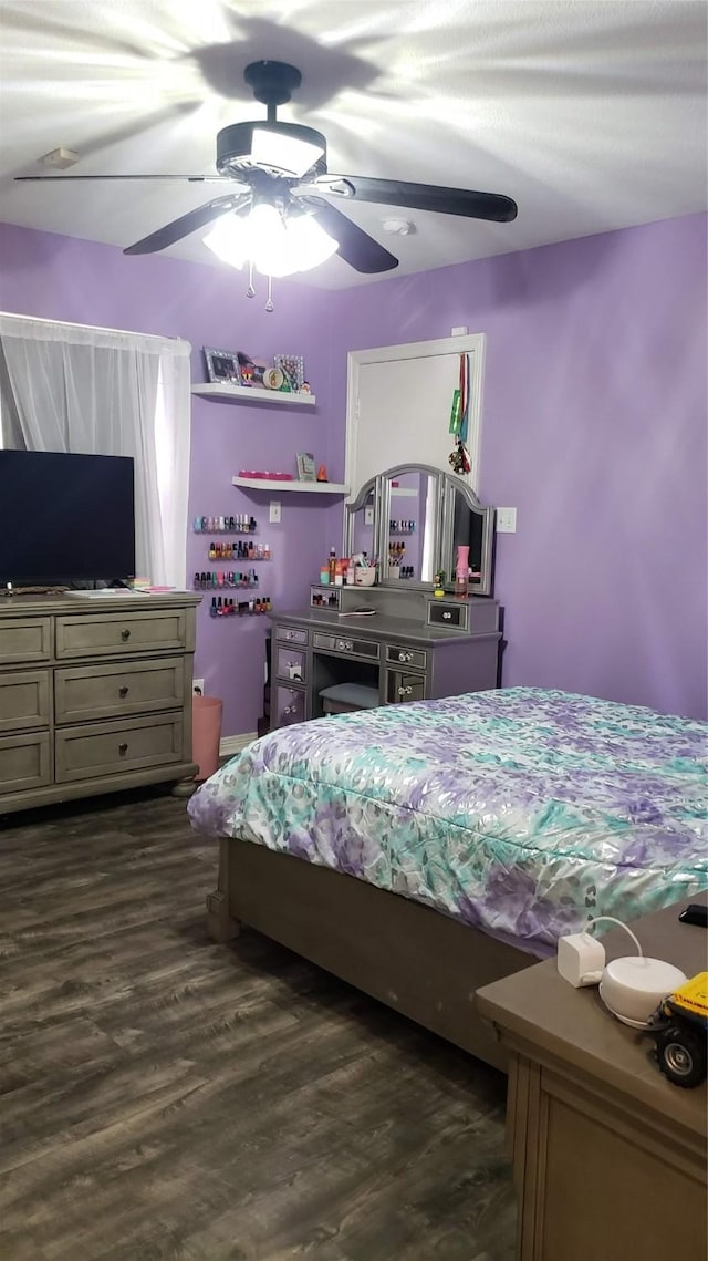 bedroom featuring dark wood-type flooring and ceiling fan