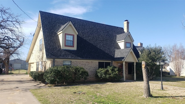 view of side of home with a yard