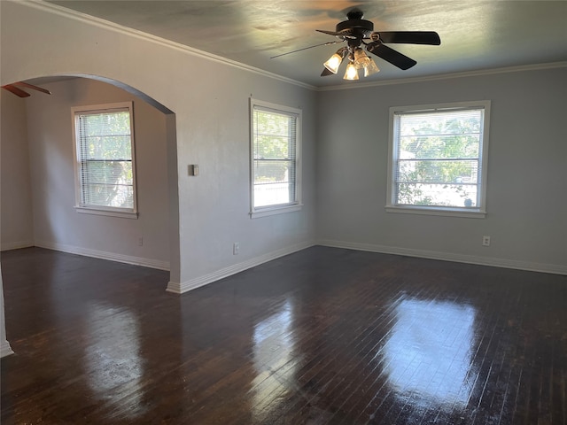 unfurnished room with crown molding, ceiling fan, and dark hardwood / wood-style floors