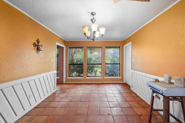 unfurnished dining area with a notable chandelier