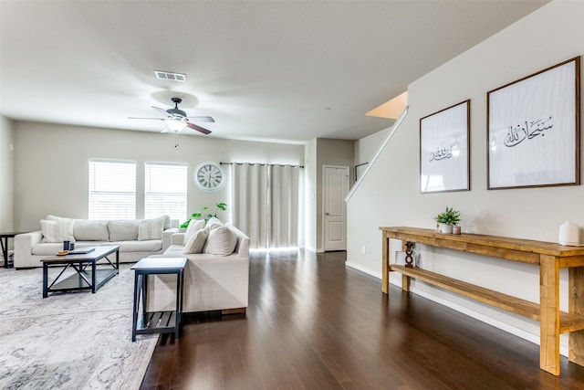 living room featuring ceiling fan and hardwood / wood-style floors