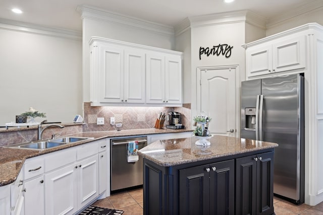 kitchen featuring a center island, stainless steel appliances, sink, dark stone countertops, and light tile patterned flooring