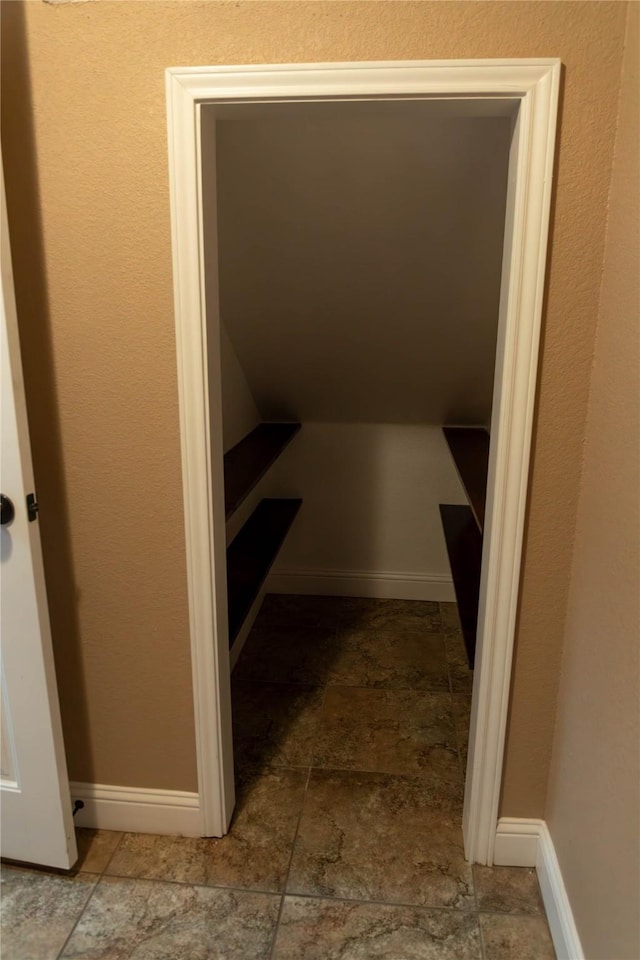 interior space featuring stone finish floor