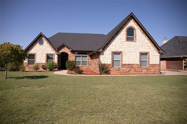 view of side of home featuring a yard