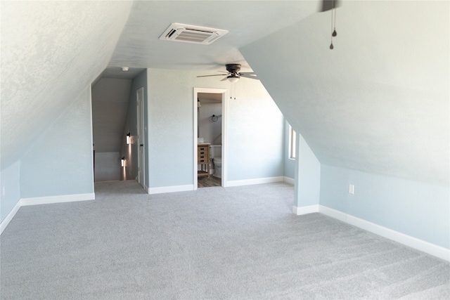 additional living space featuring lofted ceiling, ceiling fan, and carpet floors