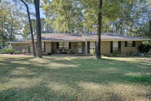 ranch-style home with a front lawn