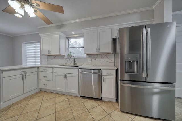 kitchen with light stone countertops, light tile patterned floors, stainless steel appliances, white cabinetry, and ceiling fan