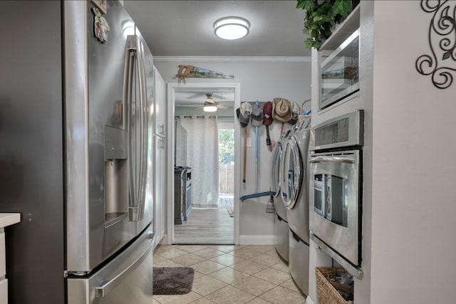 kitchen with stainless steel appliances, ornamental molding, light tile patterned floors, and ceiling fan