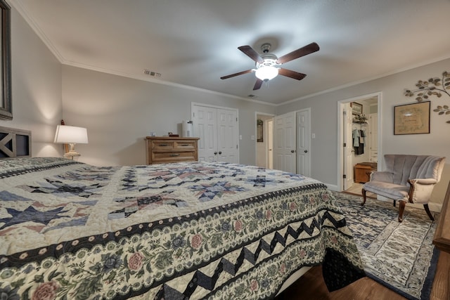 bedroom with crown molding, hardwood / wood-style floors, and ceiling fan