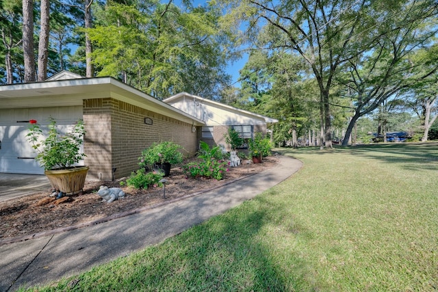 view of home's exterior with a yard