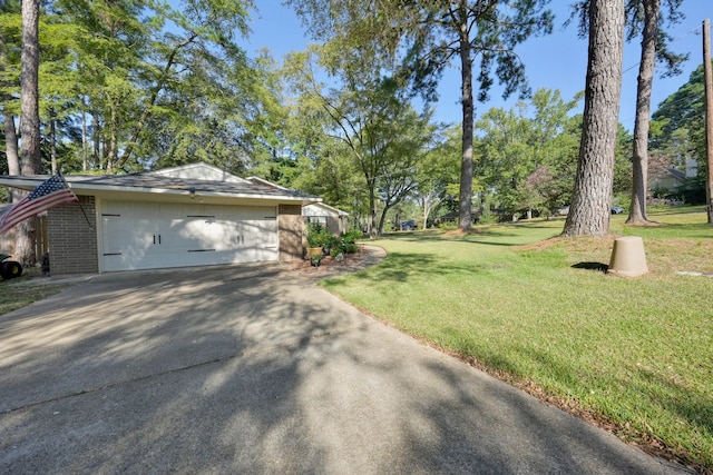 exterior space featuring a garage and a lawn