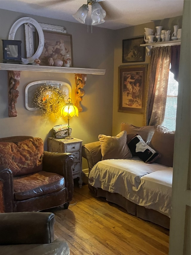 bedroom featuring wood-type flooring and ceiling fan